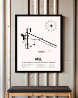 Northwest Alabama Regional Airport framed poster displayed in an airplane hangar