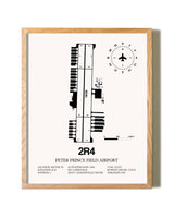 Peter Prince Field Airport framed print in natural wood frame
