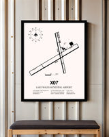 Lake Wales Municipal Airport framed poster displayed in an airplane hangar