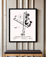 Georgetown Executive Airport At Johnny Gantt Field framed poster displayed in an airplane hangar