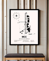 McClellan Airfield framed poster displayed in an airplane hangar