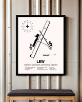 Auburn / Lewiston Municipal Airport framed poster displayed in an airplane hangar