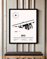 Knoxville Downtown Island Airport framed poster displayed in an airplane hangar