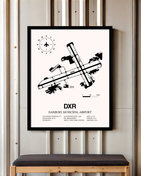 Danbury Municipal Airport framed poster displayed in an airplane hangar