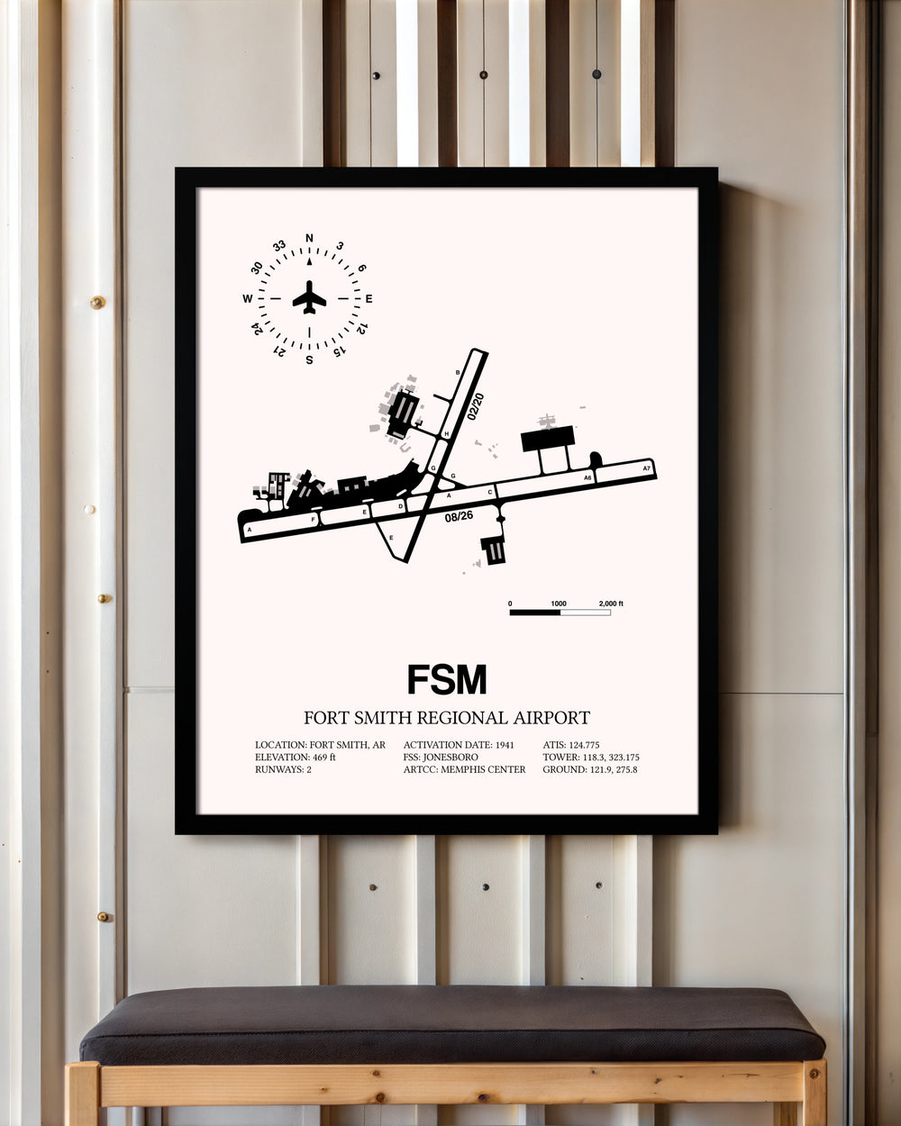Fort Smith Regional Airport framed poster displayed in an airplane hangar