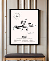 Fort Smith Regional Airport framed poster displayed in an airplane hangar