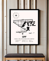 Miami-Opa Locka Executive Airport framed poster displayed in an airplane hangar