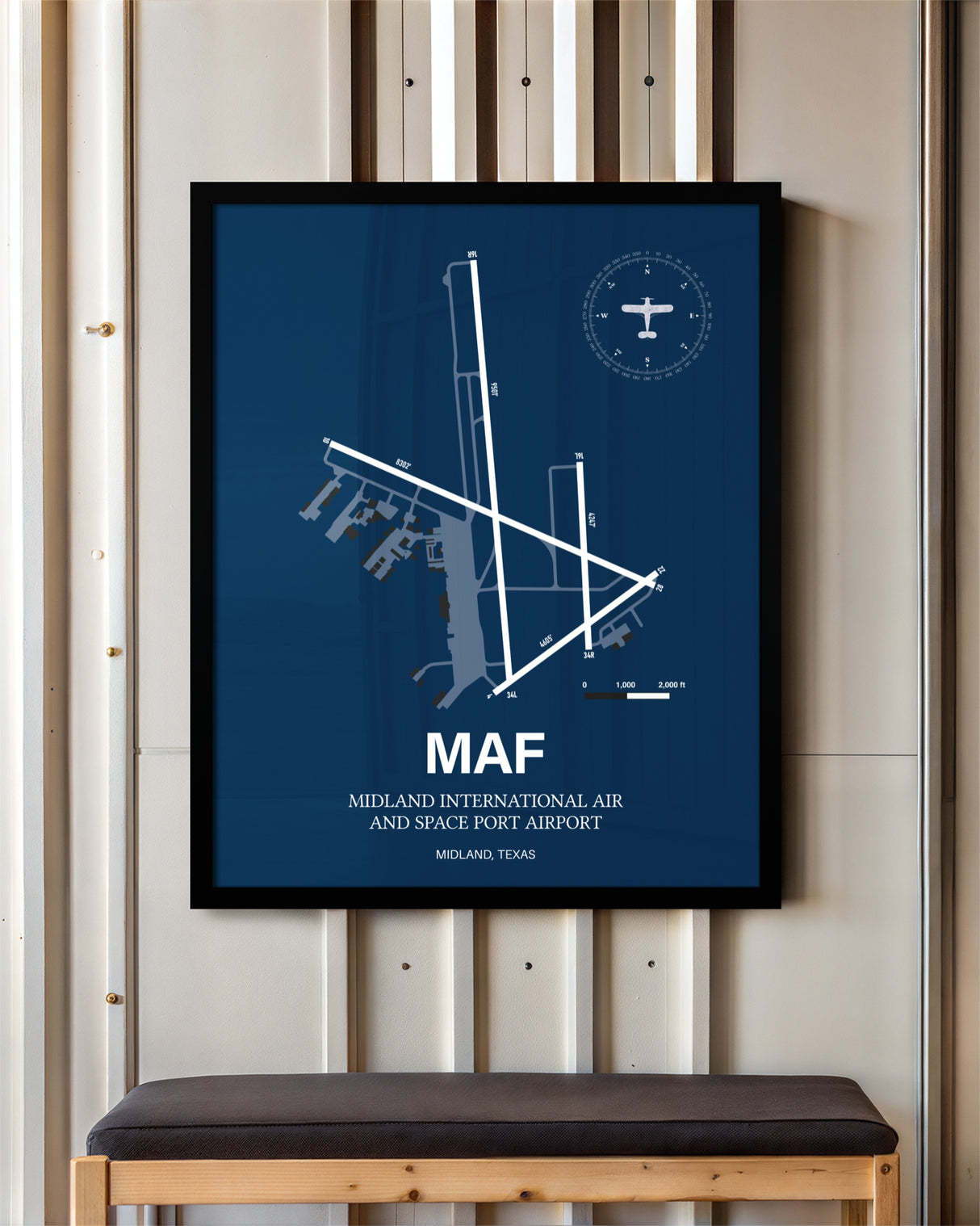Midland International Air and Space Port Airport framed poster displayed in an airplane hangar