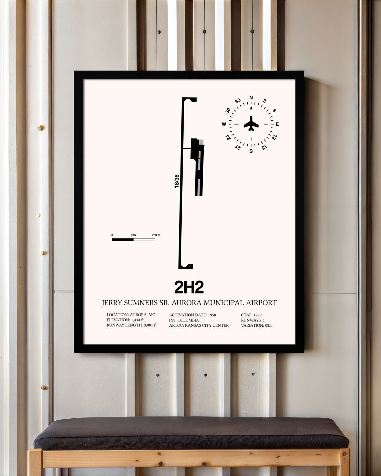Jerry Sumners Sr. Aurora Municipal Airport framed poster displayed in an airplane hangar