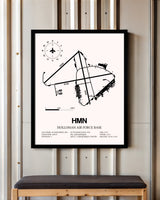 Holloman Air Force Base framed poster displayed in an airplane hangar