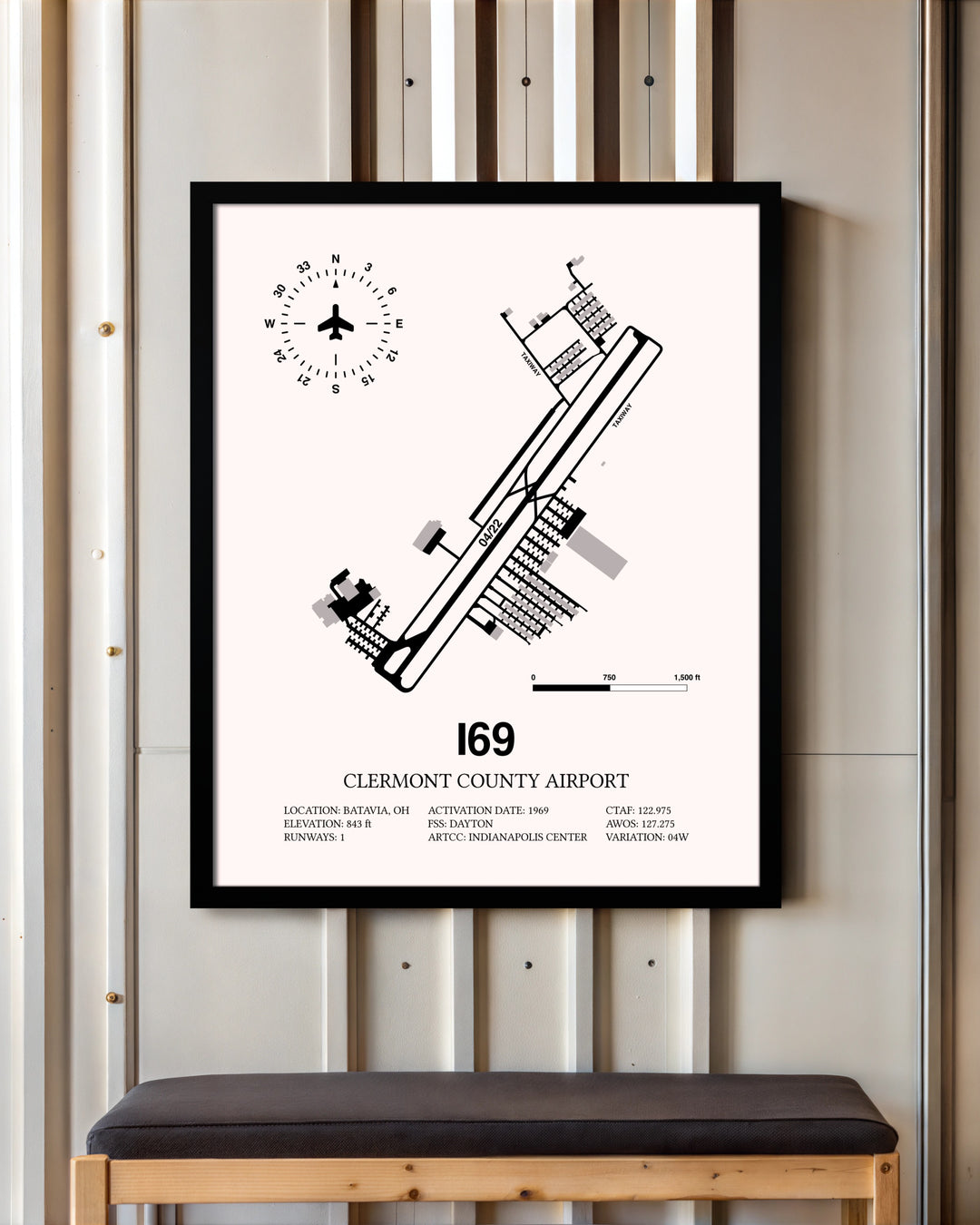 Clermont County Airport framed poster displayed in an airplane hangar