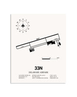 Gray Delaware Airpark framed poster displayed in an airplane hangar