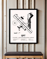 Gulfport-Biloxi International Airport framed poster displayed in an airplane hangar