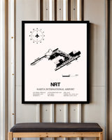 Narita International Airport framed poster displayed in an airplane hangar