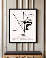 Godman Army Airfield framed poster displayed in an airplane hangar