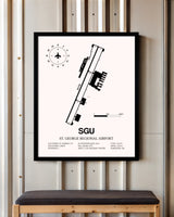 St. George Regional Airport framed poster displayed in an airplane hangar
