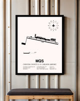 Chester County G. O. Carlson Airport framed poster displayed in an airplane hangar