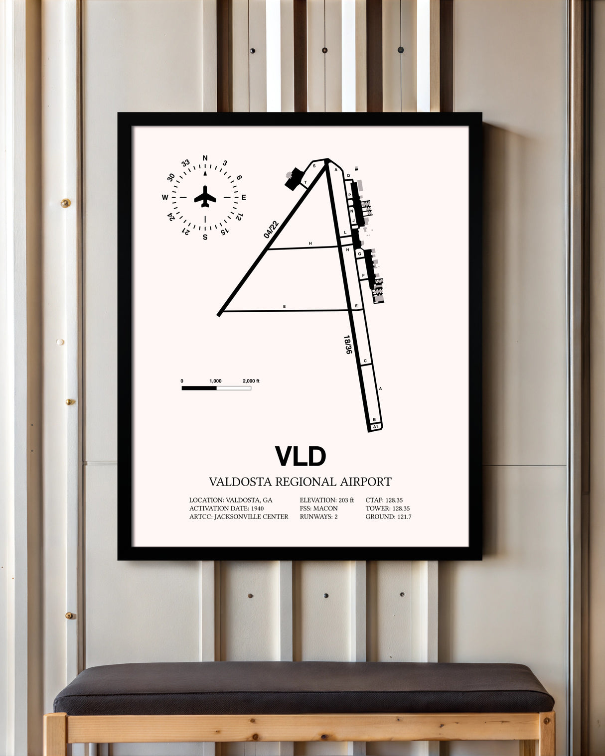 Valdosta Regional Airport framed poster displayed in an airplane hangar