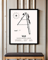 Valdosta Regional Airport framed poster displayed in an airplane hangar