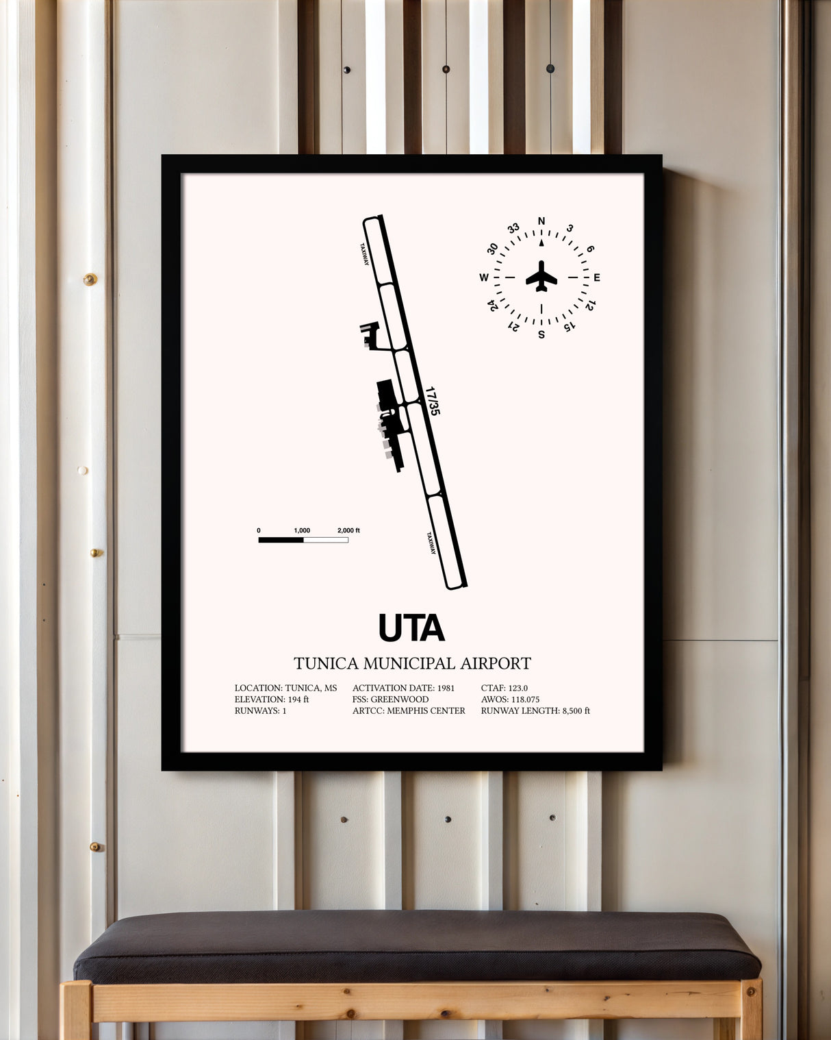 Tunica Municipal Airport framed poster displayed in an airplane hangar