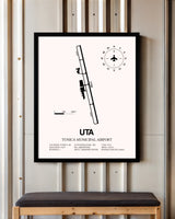 Tunica Municipal Airport framed poster displayed in an airplane hangar