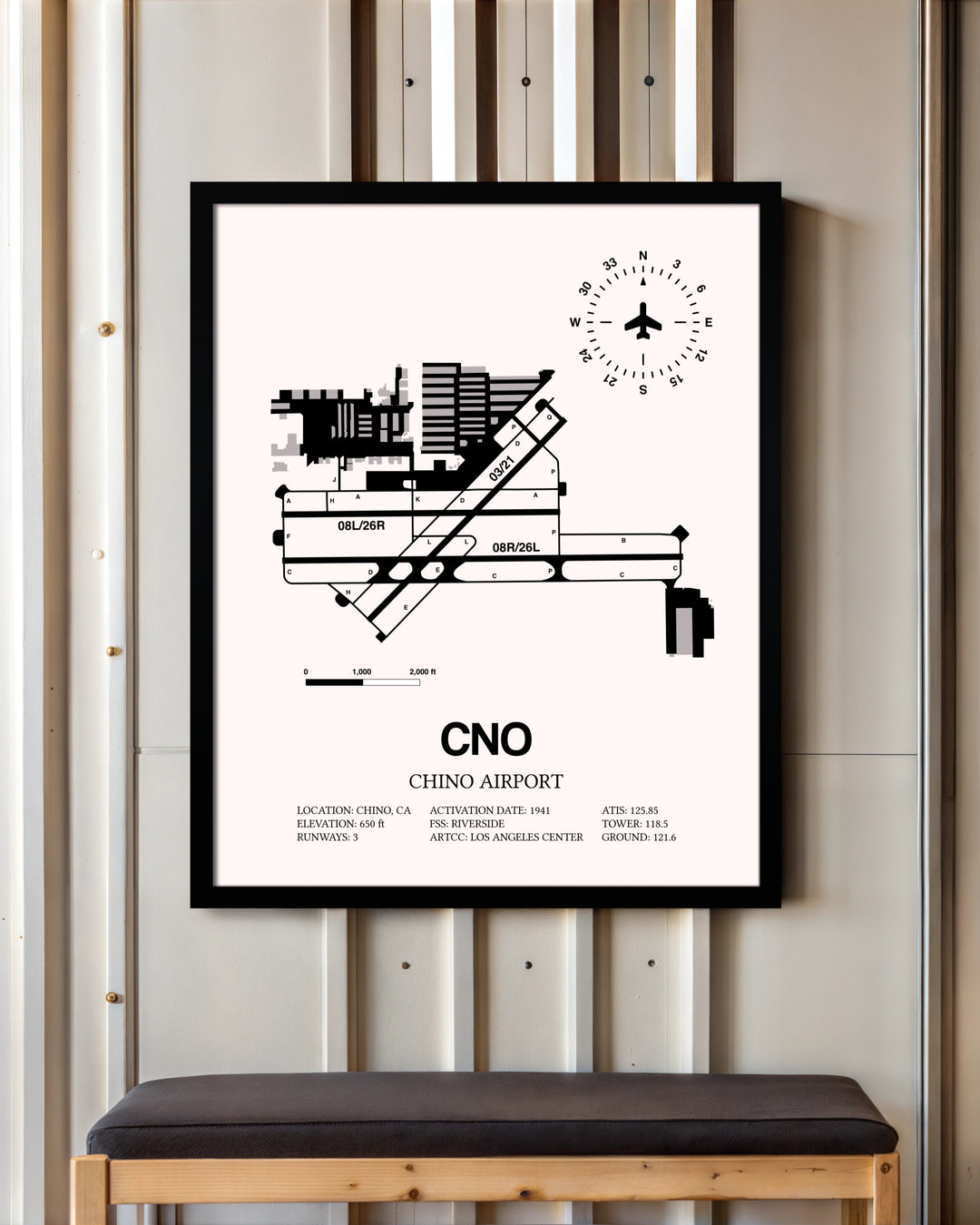 Chino Airport framed poster displayed in an airplane hangar