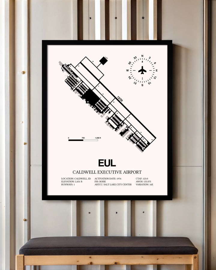 Caldwell Executive Airport framed poster displayed in an airplane hangar