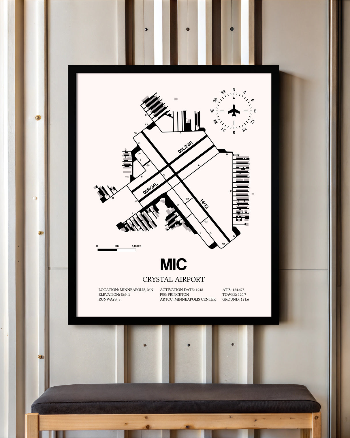 Crystal Airport framed poster displayed in an airplane hangar