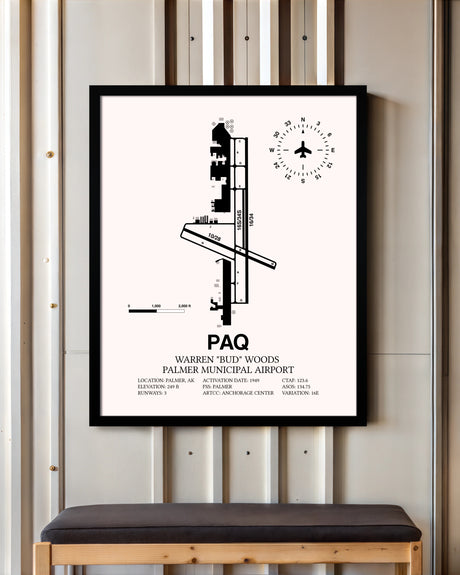 Warren "Bud" Woods Palmer Municipal Airport framed poster displayed in an airplane hangar