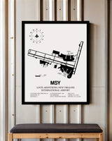 Framed Detailed Airport Map of Louis Armstrong New Orleans International Airport (MSY) in White with a Black Frame