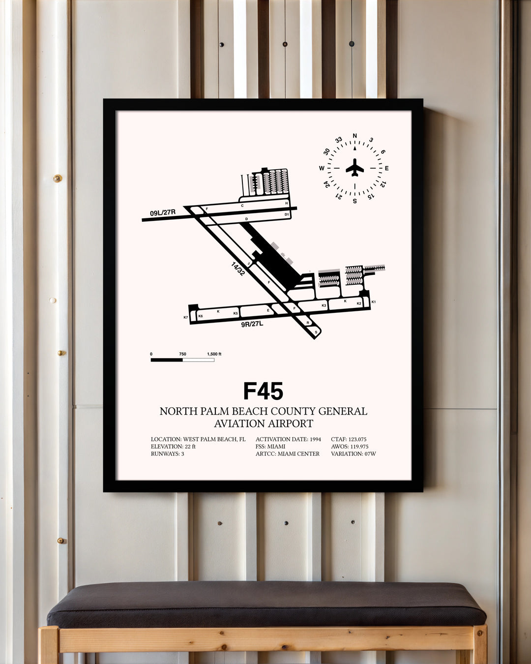 North Palm Beach County General Aviation Airport framed poster displayed in an airplane hangar