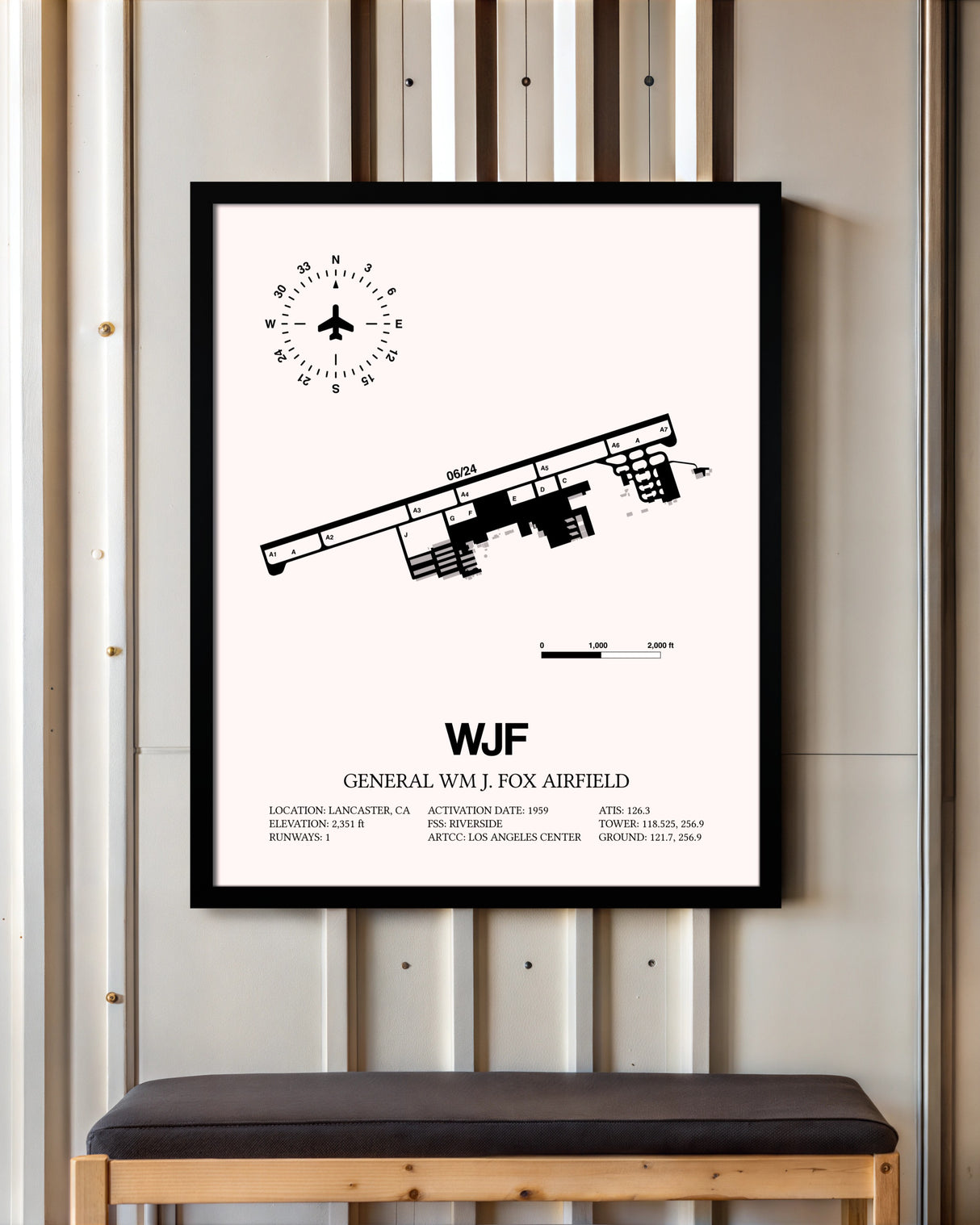 General William J. Fox Airfield framed poster displayed in an airplane hangar