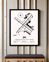 Abraham Lincoln Capital Airport framed poster displayed in an airplane hangar