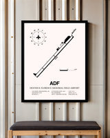 Dexter B. Florence Memorial Field Airport framed poster displayed in an airplane hangar