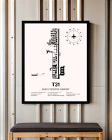 Aero Country Airport framed poster displayed in an airplane hangar