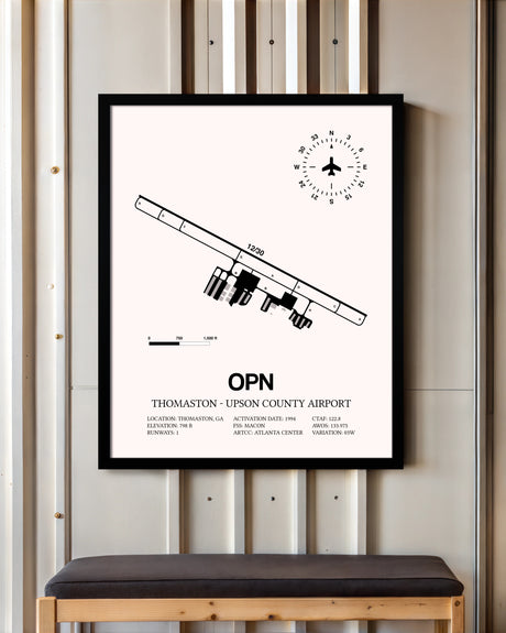Thomaston-Upson County Airport framed poster displayed in an airplane hangar