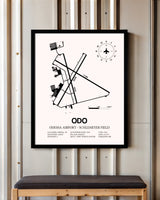 Odessa Airport-Schlemeyer Field framed poster displayed in an airplane hangar