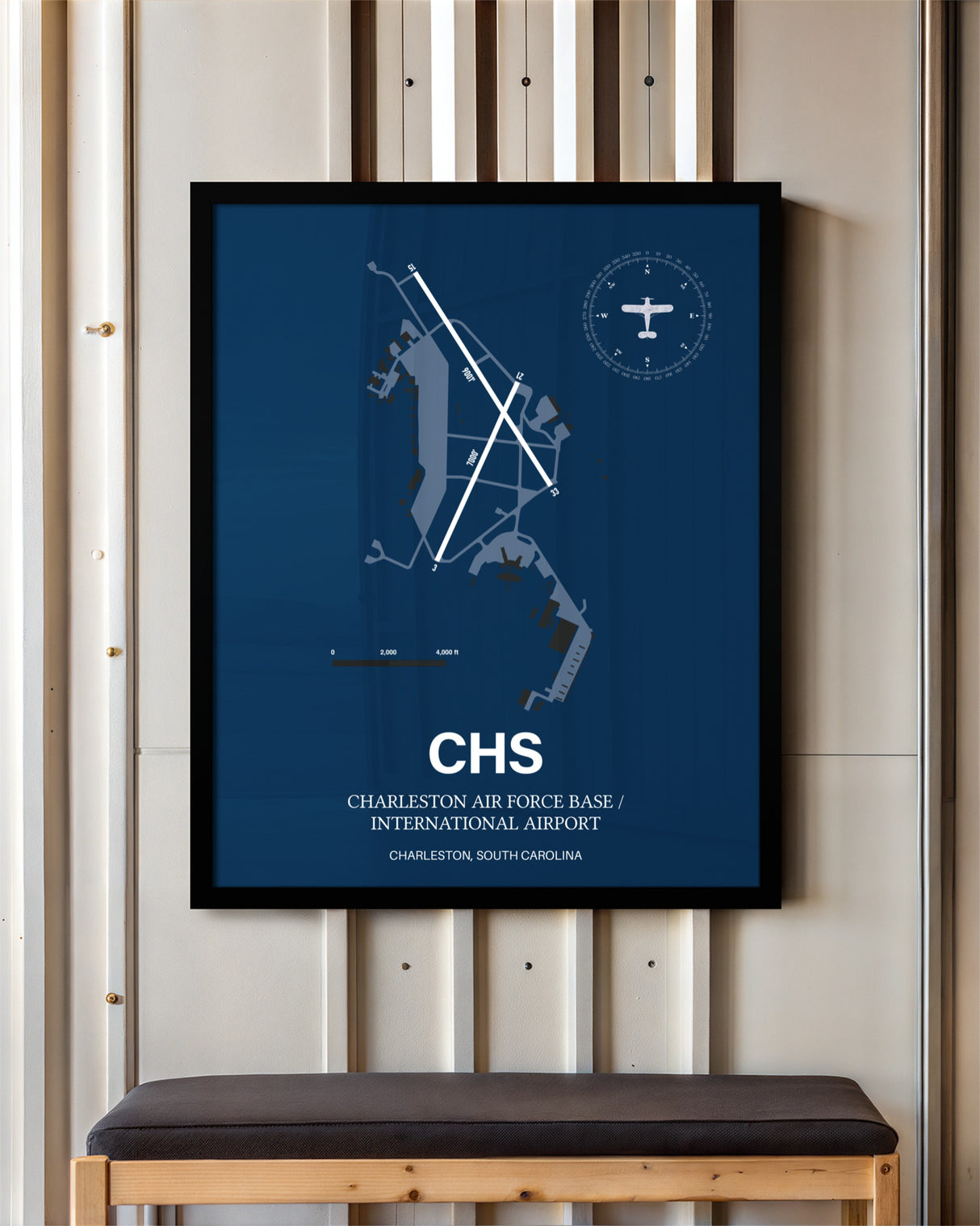 Charleston Air Force Base/International Airport framed poster displayed in an airplane hangar