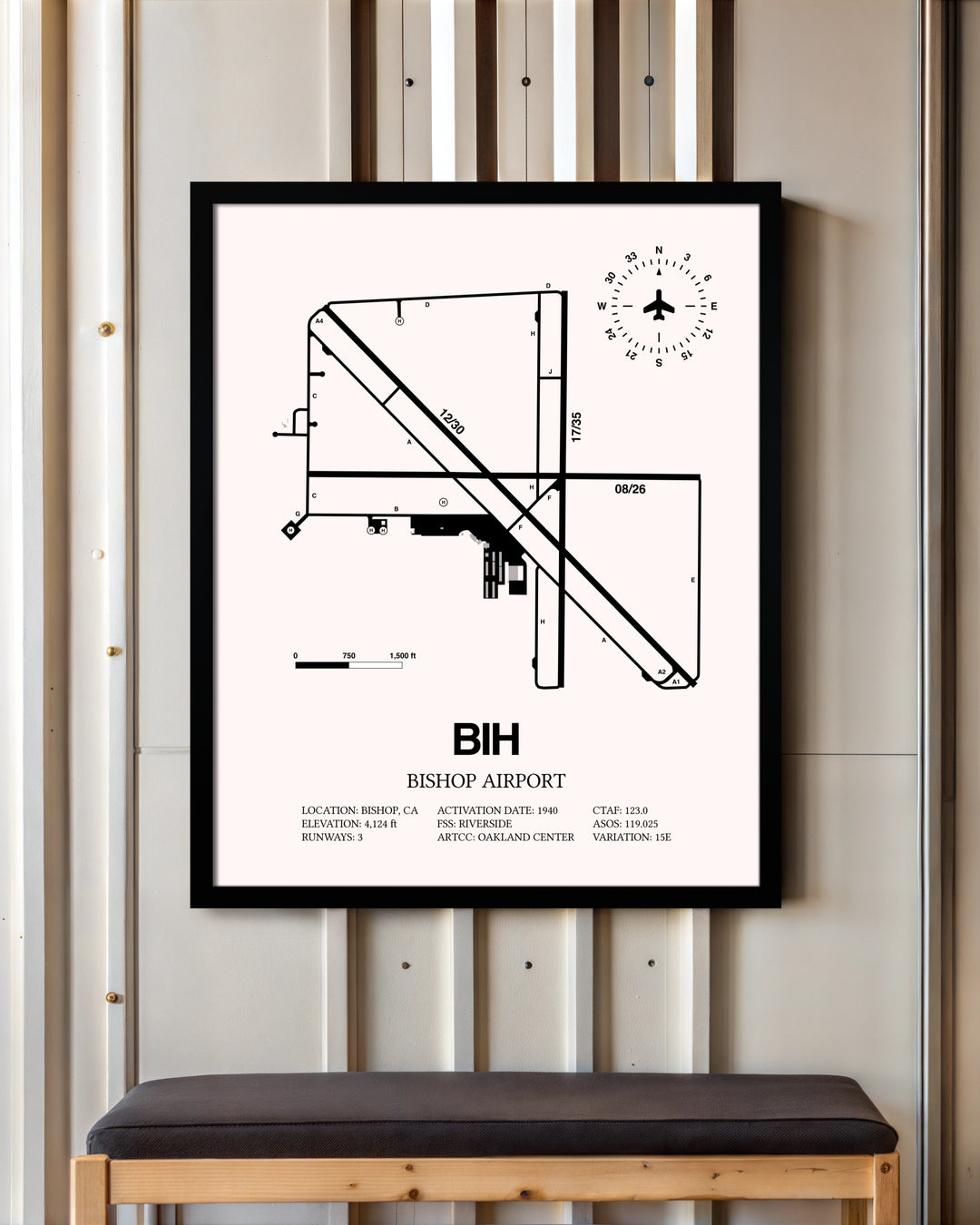 Bishop Airport framed poster displayed in an airplane hangar