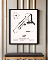 Luke Air Force Base framed poster displayed in an airplane hangar