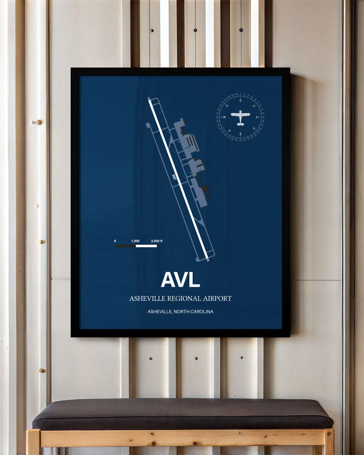 Asheville Regional Airport framed poster displayed in an airplane hangar
