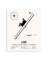 Gray Triangle North Executive Airport framed poster displayed in an airplane hangar