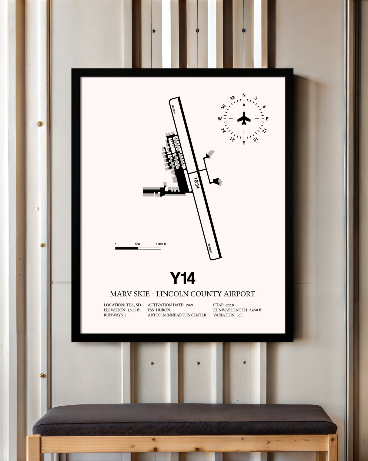 Marv Skie-Lincoln County Airport framed poster displayed in an airplane hangar