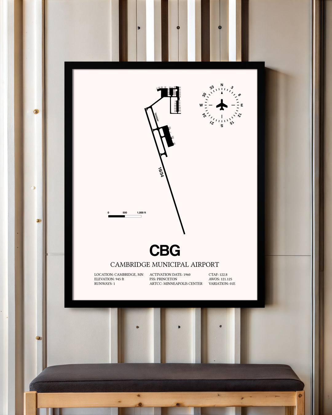 Cambridge Municipal Airport framed poster displayed in an airplane hangar