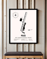 Mid-Carolina Regional Airport framed poster displayed in an airplane hangar