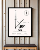 McGregor Executive Airport framed poster displayed in an airplane hangar