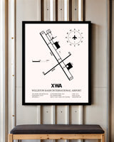 Williston Basin International Airport framed poster displayed in an airplane hangar