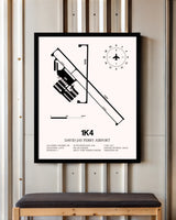 David Jay Perry Airport framed poster displayed in an airplane hangar
