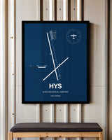 Hays Regional Airport framed poster displayed in an airplane hangar