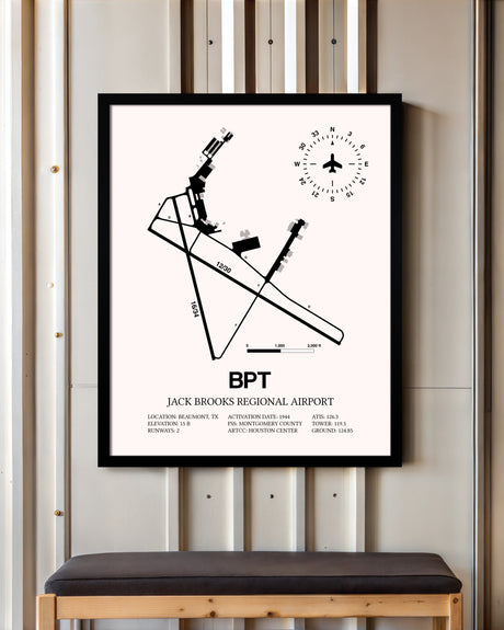 Jack Brooks Regional Airport framed poster displayed in an airplane hangar